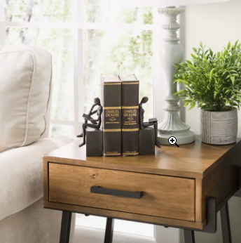 MAN AND WOMAN READING ON A BLOCK CAST IRON BOOKEND SET