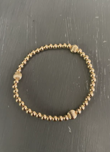 MORGAN & ME # 11a 3MM 14k GOLD FILLED BRACELET WITH 3 - 5MM GOLD FILLED CORRUGATED BEADS