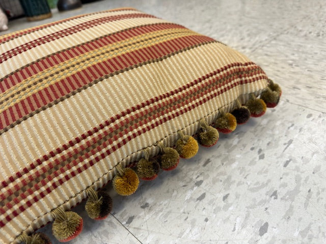 GOLD AND RED STRIPED PILLOW WITH BALL FRINGE