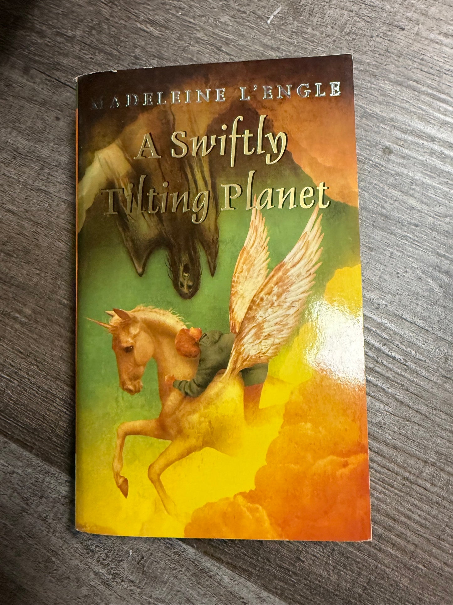 A SWIFTLY TILTING PLANET BY MADELEINE L'ENGLE - BOOK 3