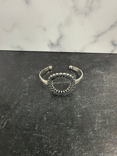 SILVER-TONE OPEN CUFF BRACELET CIRCULAR WITH BLACK TEARDROP-SHAPED STONE ACCENTS