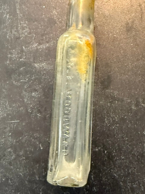 ANTIQUE CLEAR GLASS APOTHECARY BOTTLE BY ORATOR FRANK WOODWARD IN LEROY, NY