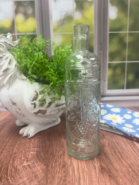 CLEAR GLASS BOTTLE WITH GRAPE PATTERN