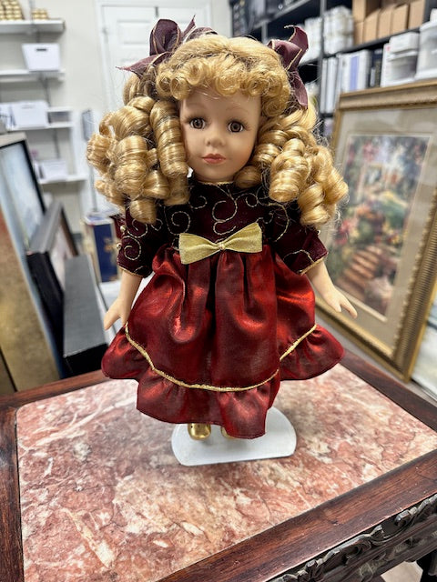 COLLECTOR'S CHOICE PORCELAIN DOLL WITH DARK RED DRESS